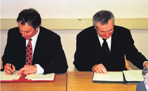  ??  ?? Historic day: Prime Minister Tony Blair and Taoiseach Bertie Ahern sign the Good Friday Agreement in 1998. Right, Arlene Foster