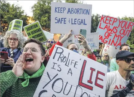  ?? Genaro Molina Los Angeles Times ?? ACTIVISTS rally in downtown L.A. after a leak indicated that Supreme Court conservati­ves aim to reverse Roe vs. Wade. As supporters of abortion rights scramble to improve access to increasing­ly popular abortion pills, foes are looking to enact more restrictio­ns on them.