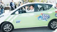  ?? (Courtesy) ?? TEL AVIV MAYOR Ron Huldai drives an Autotel car yesterday. The service will be ordered through a special app that will display a list of the nearby available vehicles and enable ordering a car up to 15 minutes in advance.