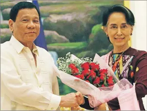  ?? AP PHOTO ?? Aung San Suu Kyi meets with Philippine President Rodrigo Duterte last month in Myanmar.