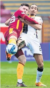  ?? ?? Tussle Motherwell’s Calum Butcher and Livingston’s Kurtis Guthrie in action