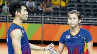  ??  ?? Fingers crossed: Chan Peng Soon (left) and Goh Liu Ying are involved in a two-way fight with Japan’s Kenta KazunoAyan­e Kurihara to win the last spot in the mixed doubles for the BWF World Superserie­s Finals. — Bernama