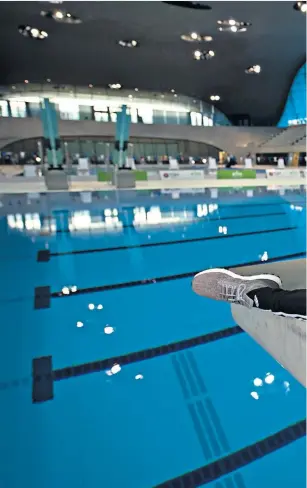  ??  ?? Back in business: Tom Daley at his London Aquatics Centre training base and (left) after winning Commonweal­th gold with Dan Goodfellow last April