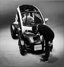  ?? CHRIS RATCLIFFE BLOOMBERG ?? Renault continues to gain momentum with its Twizy, a jewel box of a four-wheeled electric vehicle that it’s made since 2012.