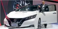  ??  ?? Fadi Ghosn at the exhibition with the Nissan Leaf.