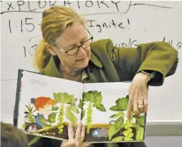  ?? ?? Board of Supervisor­s Chair Debbie Donehey pointed out Brussels sprouts while reading to a third grade class.