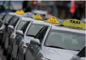  ?? TARA WALTON/TORONTO STAR FILE PHOTO ?? Licensed taxis need commercial insurance, a requiremen­t that may not apply to UberX drivers.