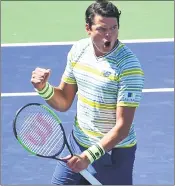  ??  ?? Milos Raonic of Canada celebrates after defeating Sam Query of United States in BNP Paribas Open quarterfin­als at Indian Wells, California.