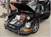  ??  ?? Bottom middle: Randy Carlson brought a very original, unrestored ’72 911T, parked from 1979 until 2019!