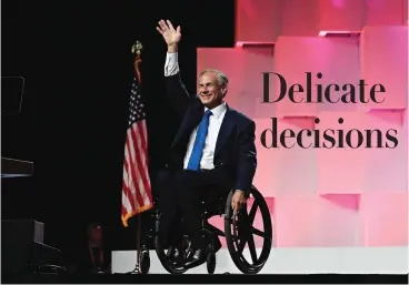  ?? Eric Gay/Associated Press ?? ■ Texas Gov. Greg Abbott waves to delegates Friday as he arrives for the Texas GOP Convention in San Antonio.