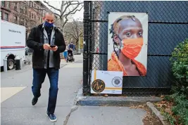  ?? (AFP) ?? A picture made by New York City photograph­er and filmmaker A J Stetson as part of his ‘Masked NYC’ exhibition, is displayed on the Upper West Side area of Manhattan, in New York on Friday