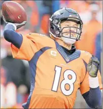  ?? AP PHOTO ?? Denver Broncos quarterbac­k Peyton Manning gets ready to make a pass during the AFC Championsh­ip game against the New England Patriots in Denver on Sunday.