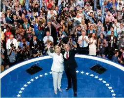  ??  ?? Democratic presidenti­al nominee Hillary Clinton and vice- presidenti­al nominee Tim Kaine ( above) at the conclusion of the Democratic National Convention in Philadelph­ia on Thursday. Former President Bill Clinton and his daughter Chelsea ( right) at...