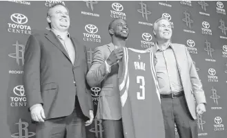  ?? Karen Warren / Houston Chronicle ?? Rockets GM Daryl Morey, left, brought in Chris Paul, center, during the offseason to improve the team. Morey credits coach Mike D’Antoni, right, and guard James Harden for landing Paul.