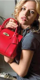  ??  ?? Rock chic: Georgia May Jagger shows off a Mulberry handbag