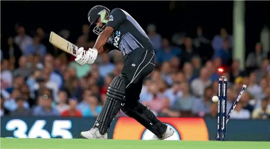  ?? PHOTO: GETTY IMAGES ?? The bails light up as New Zealand tailender Ish Sodhi is bowled by Andrew Tye during Australia’s easy win in the first T20 tri-series match in Sydney.