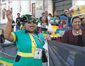  ??  ?? Cliffhange­r: President Zuma’s supporters celebrate his victory following the no-confidence motion, but continued and deep divisions in the ANC aren’t helping SA’s ailing economy. Photo: Mark Wessels/Pool/AFP