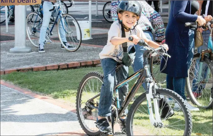  ?? PICTURE: AUSTIN HIGGINS ?? A pupil from Ines Maria Mendoza School in Puerto Rico tries out his new bicycle.