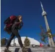  ?? JESSE WINTER/TORONTO STAR ?? Sarah Jackson, 25, passes through Toronto on a walk to St. John’s, NL.