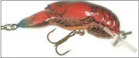  ?? KEITH SUTTON/CONTRIBUTI­NG PHOTOGRAPH­ER ?? Rebel’s Crawfish Series lures are top enticement­s for spotted bass.