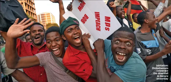  ??  ?? Jubilation: Zimbabwean­s celebrate the downfall in Harare yesterday