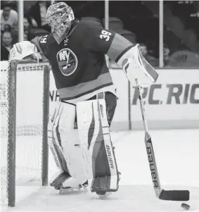  ?? PAUL J. BERESWILL/ THE ASSOCIATED PRESS ?? New York Islanders goalie Rick DiPietro is a well-paid victim in the crazy story that saw the injury-prone player signed to a 15-year, $4.5-million a season deal.