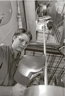  ?? Houston Chronicle file ?? Jordan Smith supervises a cladding machine at ARC Specialtie­s. The robotic machine puts a corrosion-resistant alloy on oil field valves and components.