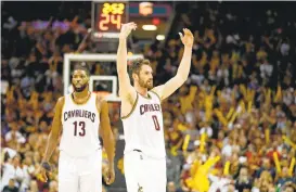  ?? GREGORY SHAMUS/GETTY IMAGES ?? The Cavaliers’ Kevin Love, right, with Tristan Thompson, pumps up the crowd during Game 4 against the Celtics. The Cavs can wrap up the series and advance to the Finals on Thursday.