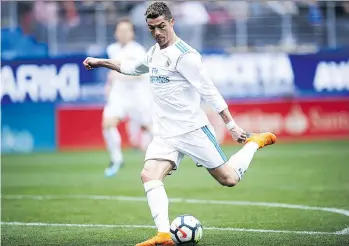  ?? JUAN MANUEL SERRANO ARCE/GETTY IMAGES ?? Cristiano Ronaldo’s 12 goals in the Champions League for Real Madrid this season are more than the entire Juventus team, which has scored just 11 times in eight games.