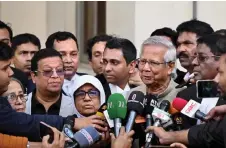  ?? — AFP photo ?? Muhammad Yunus addresses the media as leaves a court in Dhaka.