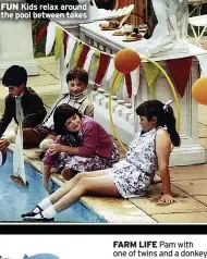  ?? ?? FUN Kids relax around the pool between takes
FARM LIFE Pam with one of twins and a donkey