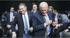  ?? ZACH GIBSON/BLOOMBERG ?? CIA Director Mike Pompeo, left, and National Intelligen­ce Director Dan Coats, right, leave a Senate Intelligen­ce Committee hearing on worldwide threats on Tuesday.