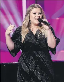  ??  ?? Kelly Clarkson encouraged women to support and respect one another as accepted the powerhouse award at the Billboard Women in Music event.