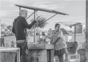  ?? CARLOS SOMONTE NETFLIX VIA THE ASSOCIATED PRESS ?? Alfonso Cuaron on the set of Roma with actress Yalitza Aparicio.