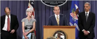  ?? AP PHOTO ?? HHS and U.S. Justice Department officials announce 107 fraud-related arrests during a news conference May 2.