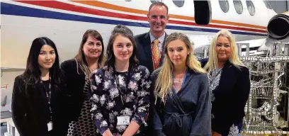  ??  ?? Ian Peart from Marshall Aerospace and Defence Group (centre) inside Macclesfie­ld College’s aerospace training hangar with (from left) Ella Tsui-Lau, head of STEM at the college, Chantelle Dewberry, assistant principal, students Ella Crews and Agata...