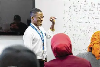  ?? CONTRIBUTE­D PHOTOS ?? After immigratin­g to the United States in 2015, Kalinda made his way to Dayton. He now teaches English as a Second Language and said he is grateful to be able to help others.