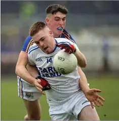  ??  ?? Wicklow’s Eoin Doyle under pressure from Longford’s Oisin O’Toole.