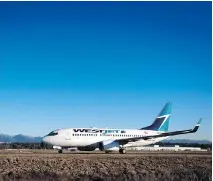  ?? DARRYL DYCK/THE CANADIAN PRESS FILES ?? WestJet says that its joint venture with Delta will see the airlines co-ordinate schedules and pricing and expand their trans-border network.