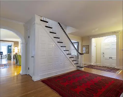  ?? Press|Cuozzo Realtors ?? The entry foyer at 29 Hartford Turnpike in Hamden is distinguis­hed by a beautiful staircase wrapped in elegant moldings, millwork and hardwood floors. Architect Alice Washburn created this Colonial Revival-style home in 1929 and it is listed for $935,000.