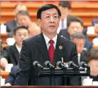  ??  ?? Procurator-General Cao Jianming delivers Supreme People’s Procurator­ate Work Report to lawmakers in Beijing on Friday.