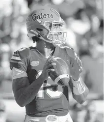  ?? PHELAN M. EBENHACK/AP ?? Florida quarterbac­k Anthony Richardson passed for just 82 yards on 20 attempts during a 34-7 loss to Georgia before leaving with a concussion, and his availabili­ty remains in doubt at South Carolina.