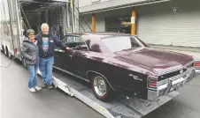  ?? ALYN EDWARDS/ DRIVING ?? Garry and Darlene Cassidy take delivery of a 1967 Chevelle SS at their Langley showroom. The car was sold at the recent Barrett-jackson auction by Vancouver dealer Wayne Darby.