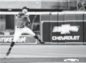  ?? Brett Coomer / Staff photograph­er ?? Correa, who was worth a career-best 21 defensive runs saved in the regular season, took away a leadoff single from Tim Anderson in Friday’s first inning with a spectacula­r play at short.