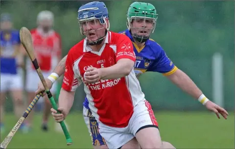  ??  ?? Shane Kehoe of Monageer-Boolavogue under pressure from Conal Grant (St. Mary’s, Rosslare).