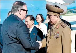  ?? MATTHEW LEE/GETTY-AFP ?? Secretary of State Mike Pompeo meets a North Korean general and other officials after arriving Wednesday at the airport in Pyongyang, the capital. He left with three detainees.