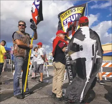  ?? Joe Cavaretta South Florida Sun-Sentinel ?? DEMONSTRAT­ORS protest at the Broward County Supervisor of Elections office in Lauderhill. “The people who come to Florida come from different ends of the spectrum,” says Republican consultant Ron Pierce.