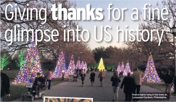  ??  ?? Festive lights hang in the trees at Longwood Gardens, Philadelph­ia