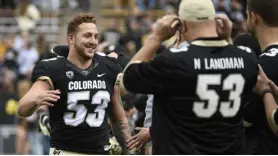  ?? ?? Buffs linebacker Nate Landman greets his family for Senior Day before Saturday’s game against the Washington Huskies.