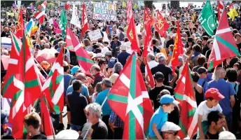  ??  ?? Anti-G7 protesters gather before a protest march on the French-Spanish border in Hendaye.